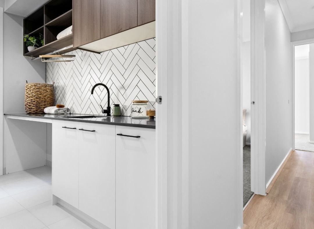 Butler's pantry with white cabinetry at Lot 301 Montego Boulevard